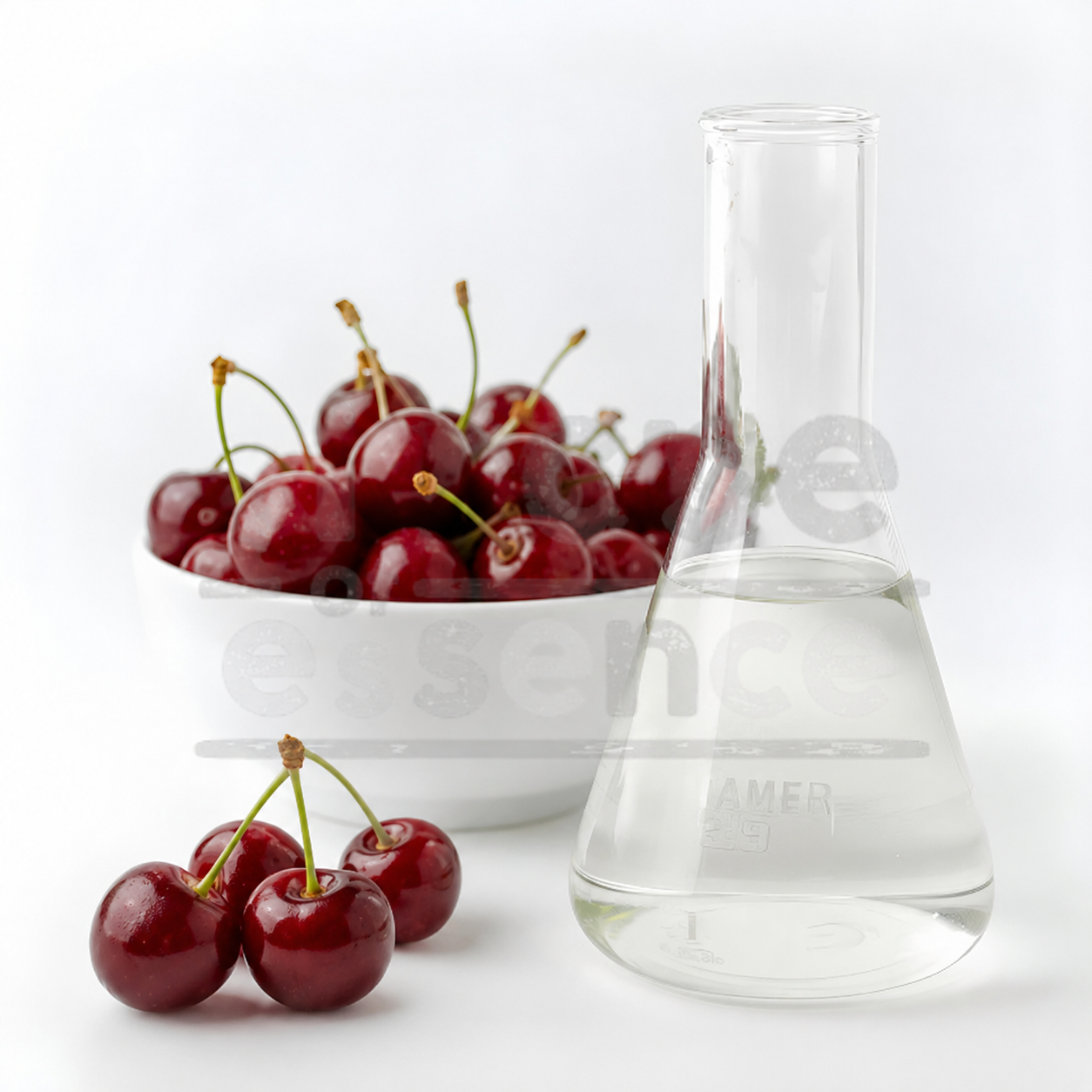 Bowl of cherries next to a beaker with a clear liquid on a white background