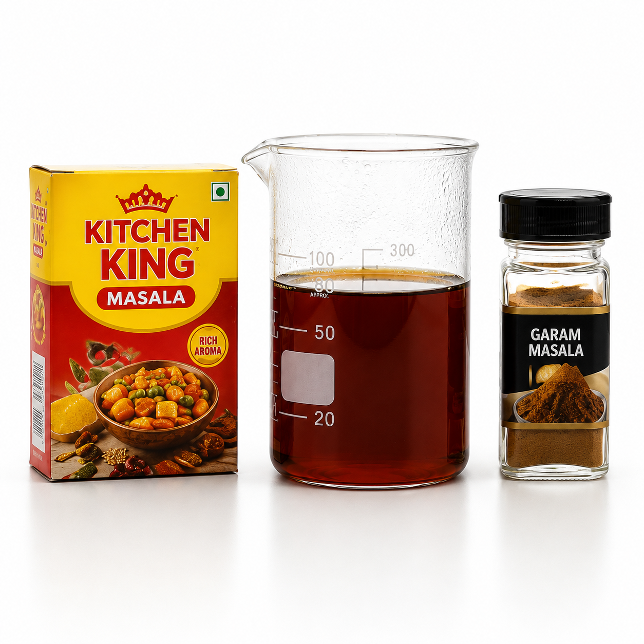 Kitchen King Masala box, beaker with liquid, and Garam Masala jar on a white background