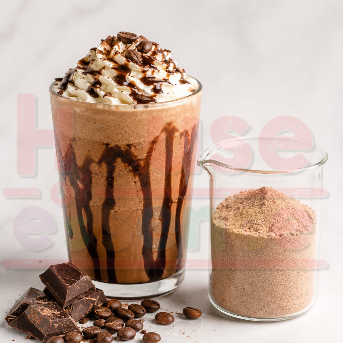 A tall glass of chocolate milkshake topped with whipped cream and chocolate drizzle, shown next to a small glass container of brown powder, with chocolate chunks and coffee beans on a light marble surface.