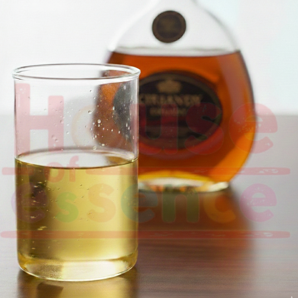 Glass of whiskey with a bottle in the background on a reflective surface